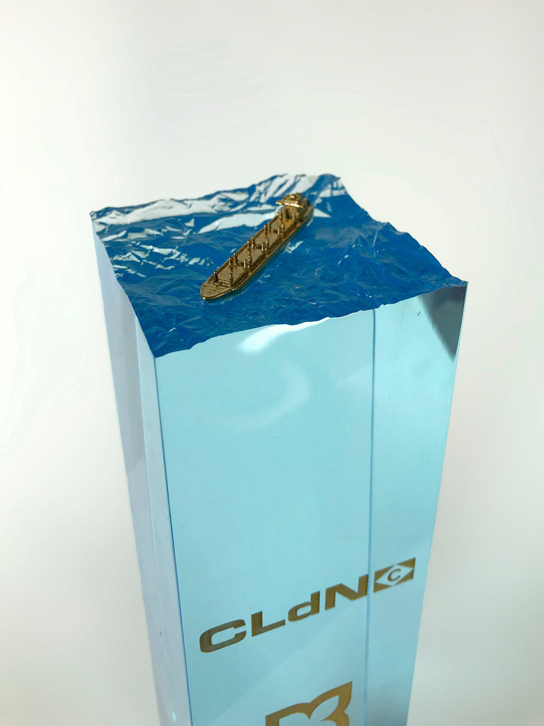 Gold Ship on Blue Waves Creative Awards London Limited