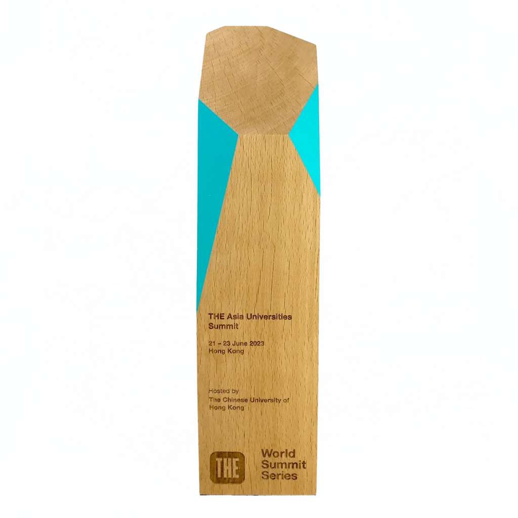 Tall wooden award with World Summit Series engraved on it