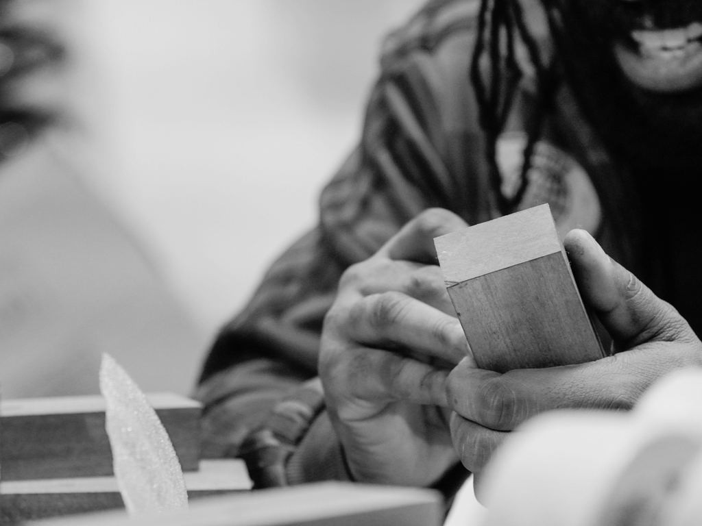 In Creative Awards London workshop a craftsman handworks on a piece of sustainably sourced wood for an designer off-the-shelf award