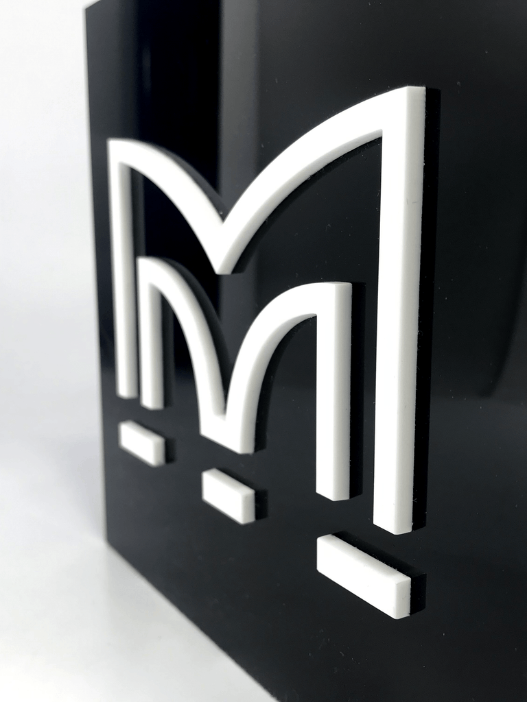 White Perspex M on Black Acrylic Award Creative Awards London Limited