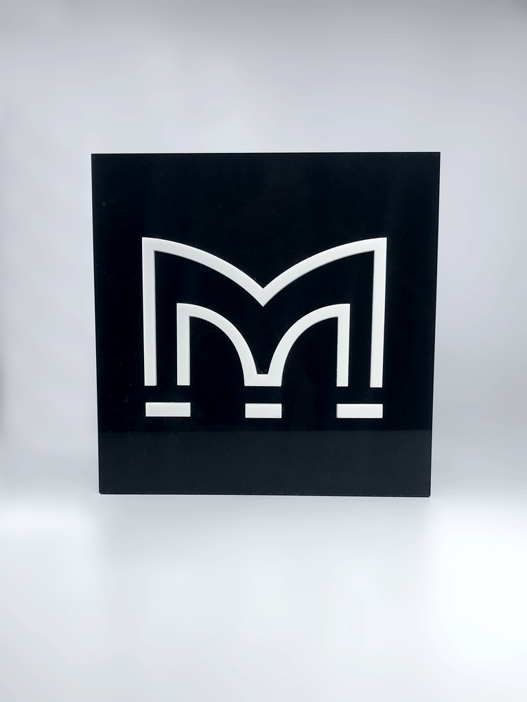 White Perspex M on Black Acrylic Award Creative Awards London Limited