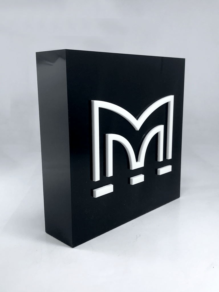 White Perspex M on Black Acrylic Award Creative Awards London Limited